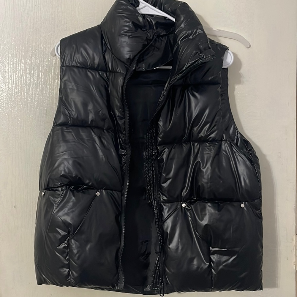 Black size small puffer vest.